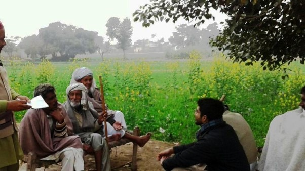 Haroon with villagers