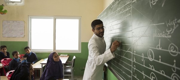 Haroon writing on black board