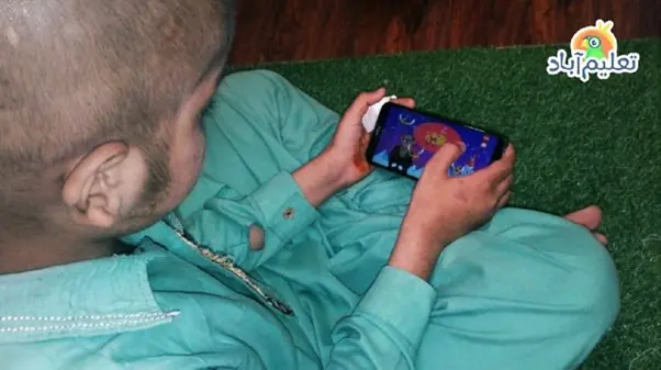 Kid watching taleemabad video on mobile