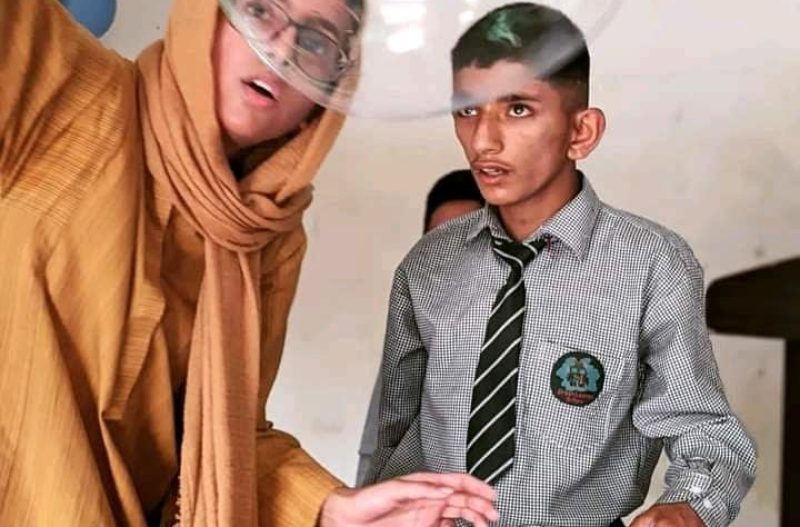 student and teacher in school